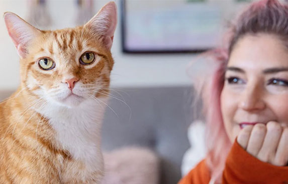 Orange cat and Samantha Bell