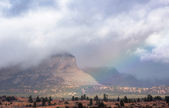 Rainbow over canyon