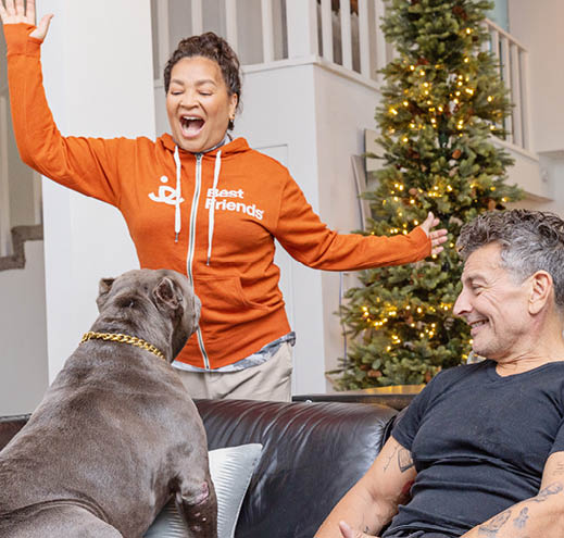 Woman wearing an orange Best Friends Zip Up Hoodie